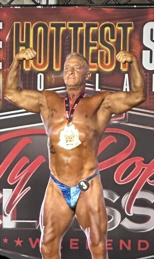 Nick on stage at the Ty Pope Classic with his medal